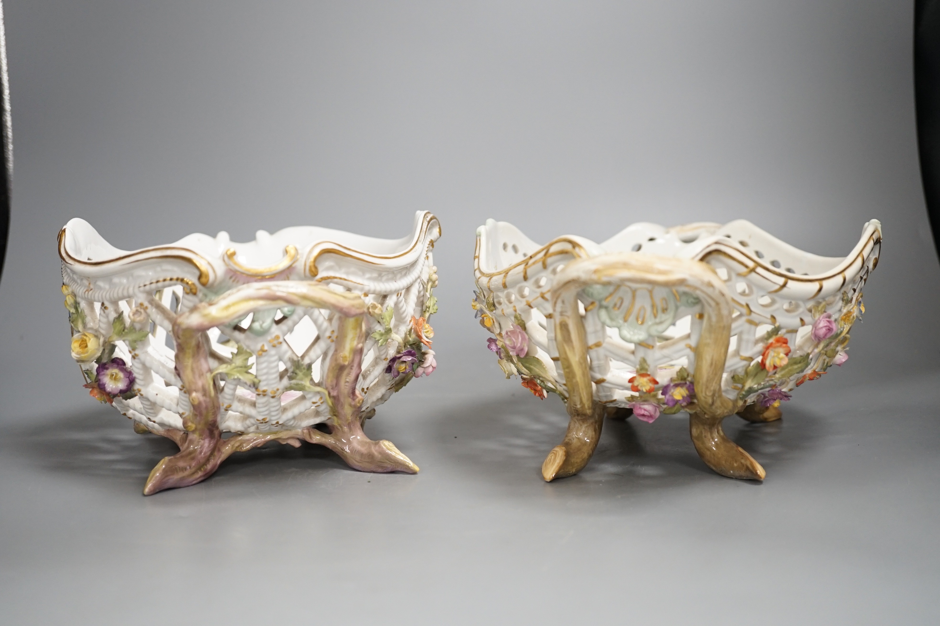Two similar late 19th century Meissen floral encrusted pierced porcelain bowls 27cm
